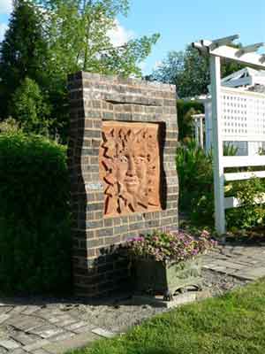Green Man brick sculpture